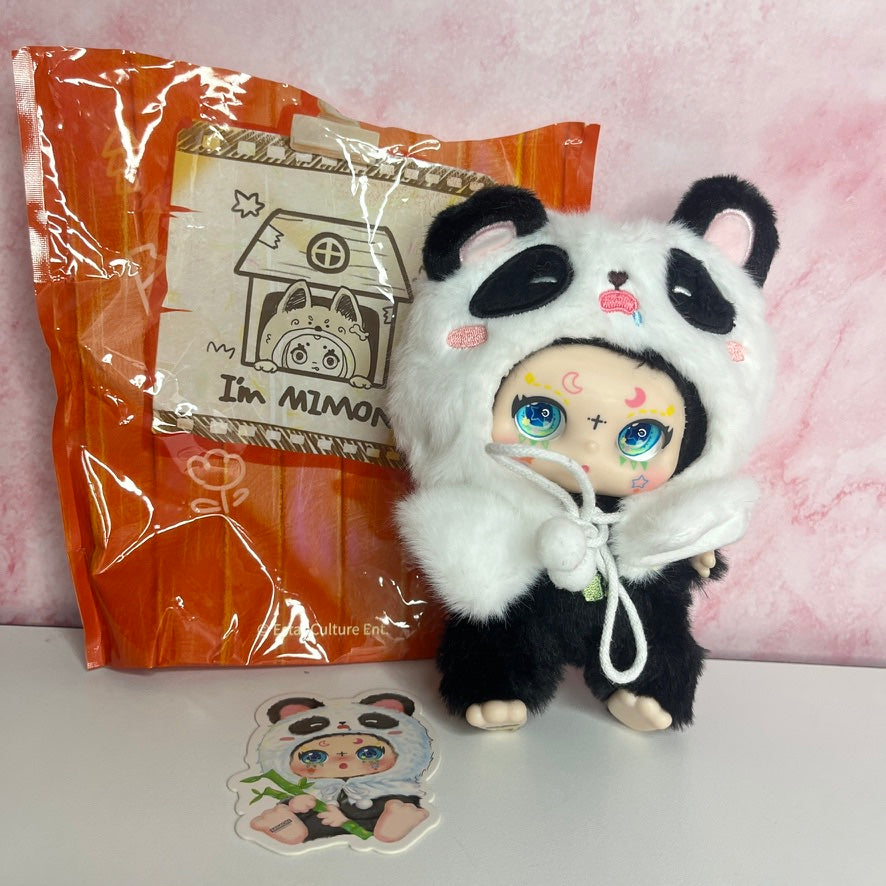 Plush toy in panda costume with packaging and sticker on a pink background